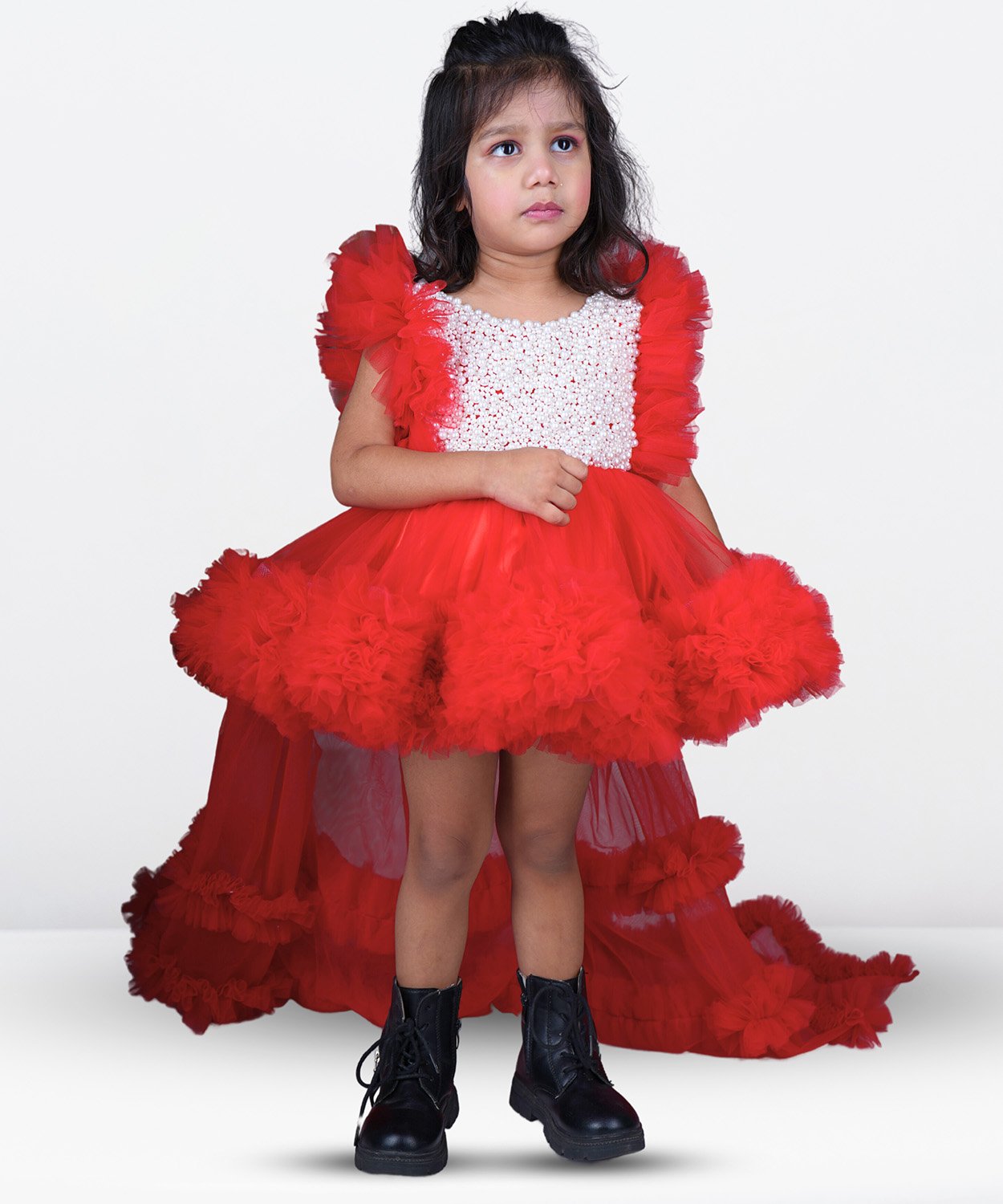 A Vibrant Pink Dress With Puffy Sleeves And A Full, Pleated Skirt, Perfect For Kids. 